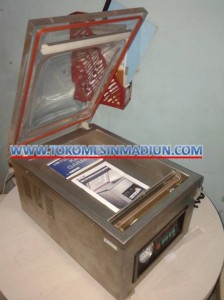 mesin pengemas produk sistem kedap udara atau vacuum machine